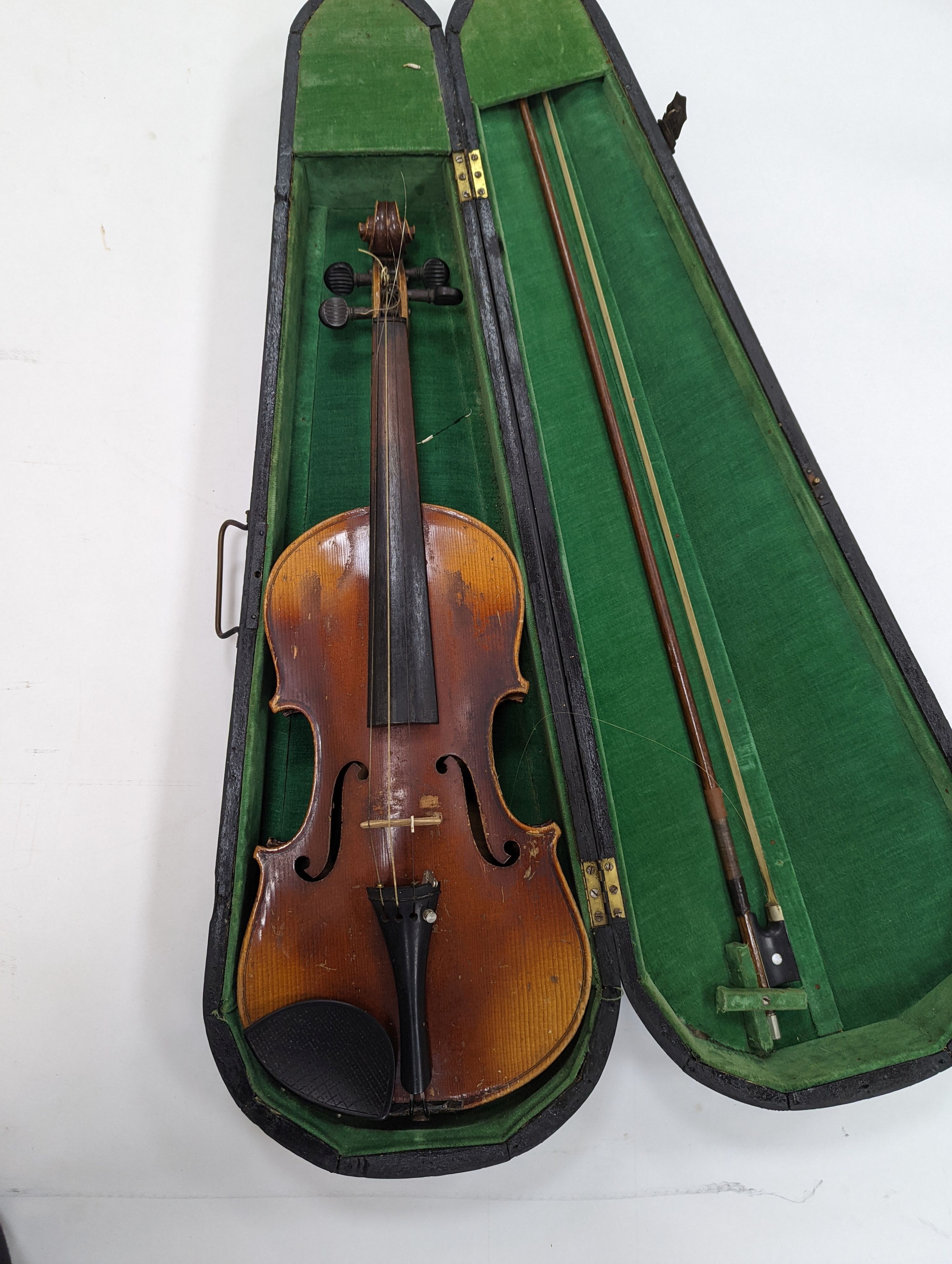 Two cased violins and bows, one with ‘Antonius Straduarius Cremonensis Faciebat Anno 17/13 Made In Czechoslovakia’ label to interior